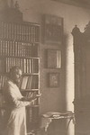 Прот.Н.К.Чуков в кабинете у библиотеки